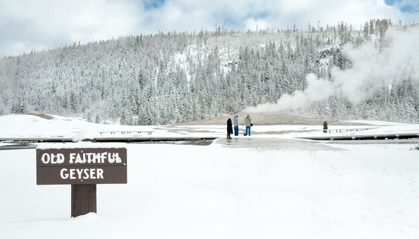 Yellowstone National Park's Old Faithful Geyser in winter
