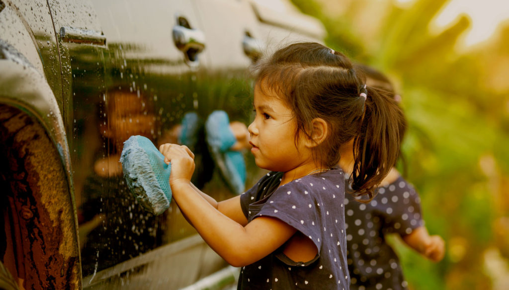 girl washing a car