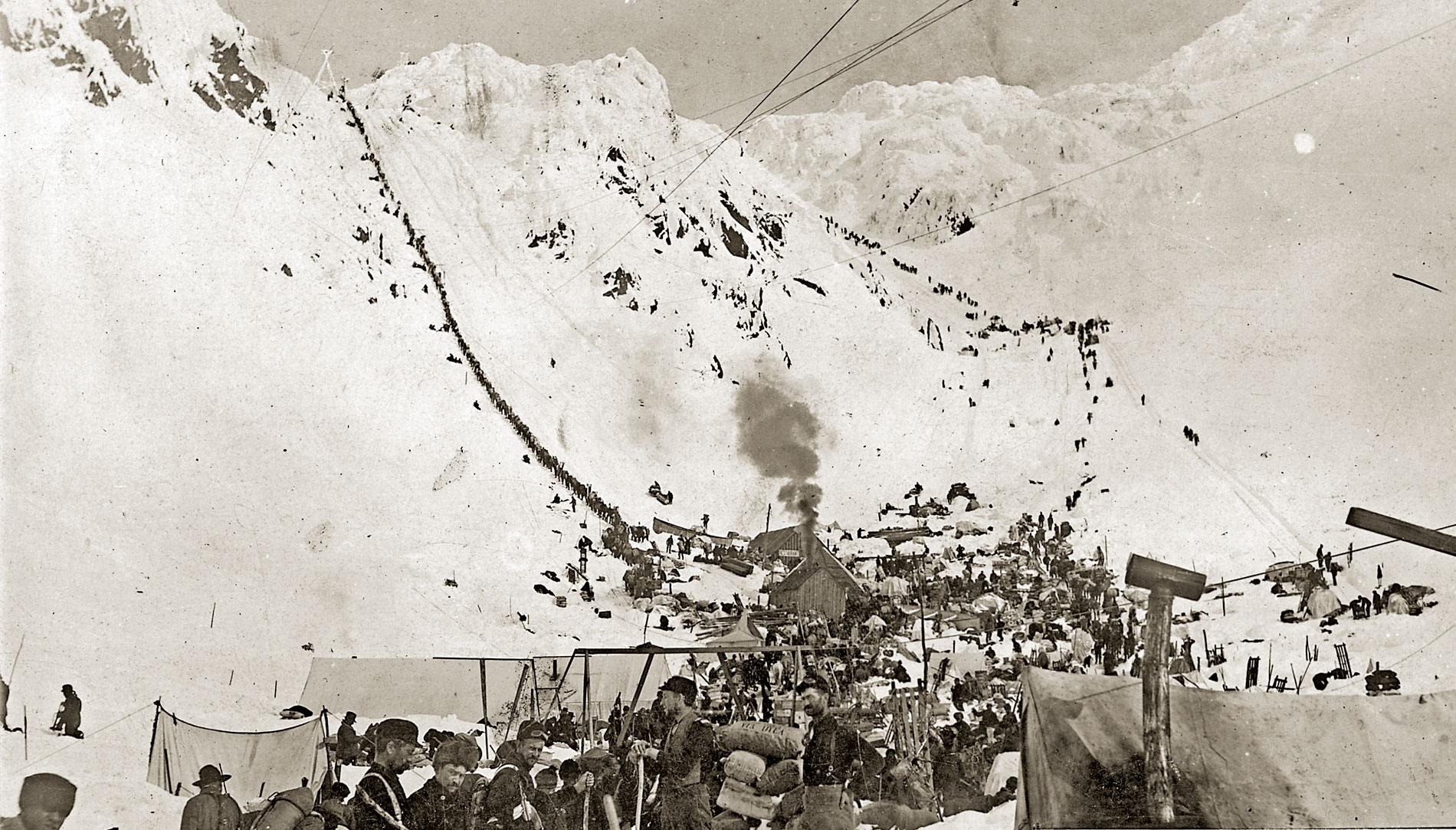 Gold Rush prospectors climb the Golden Stairs over Chilkoot Pass