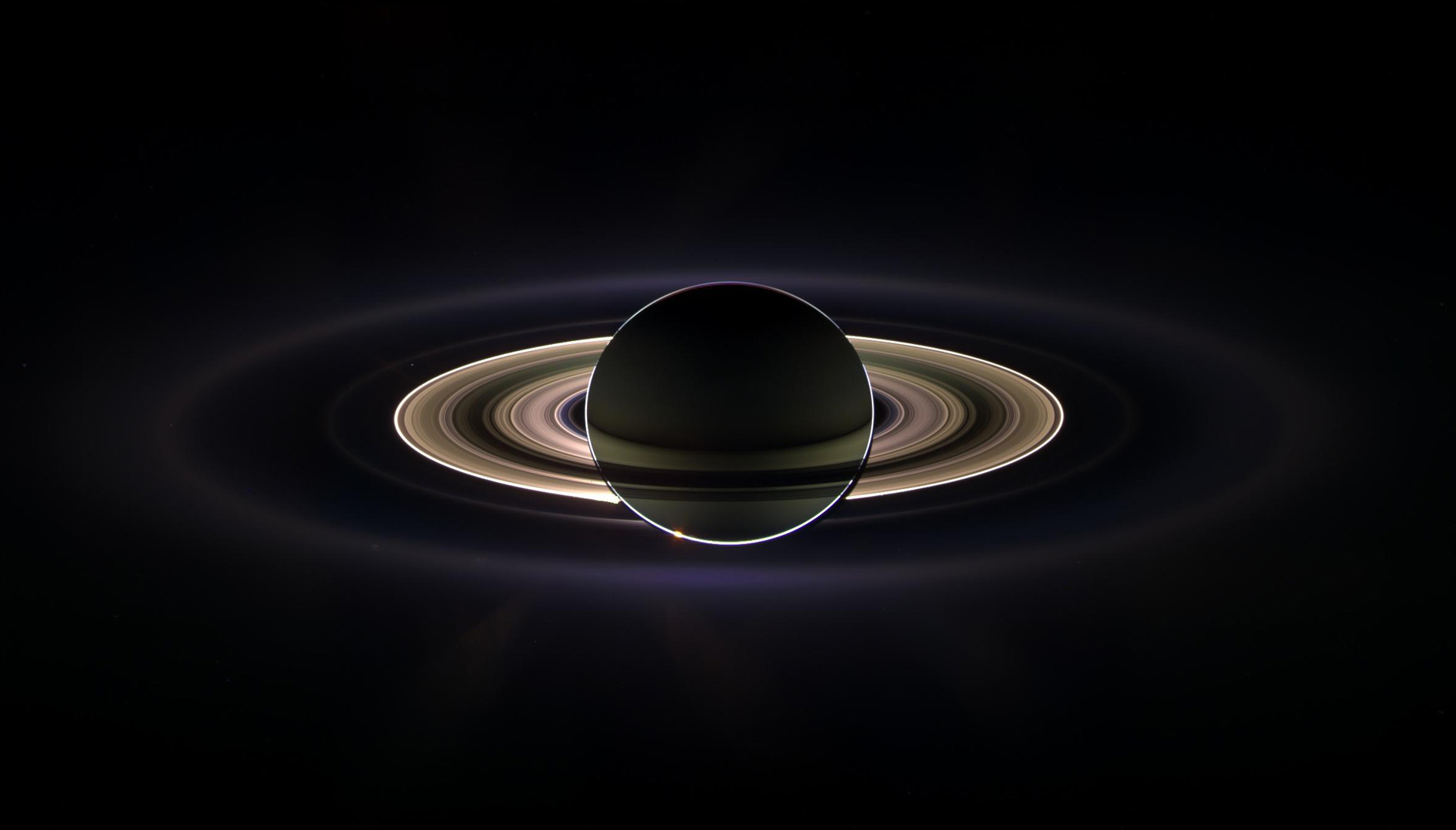 Saturn and its rings photographed from inside the planet's shadow by the Cassini spacecraft.