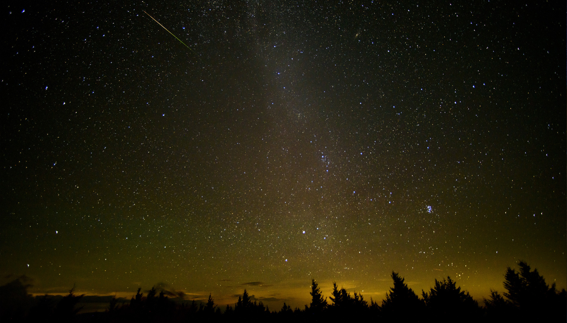 A streaking meteor (captured with a 30-second photo exposure) during the annual Perseid meteor shower.