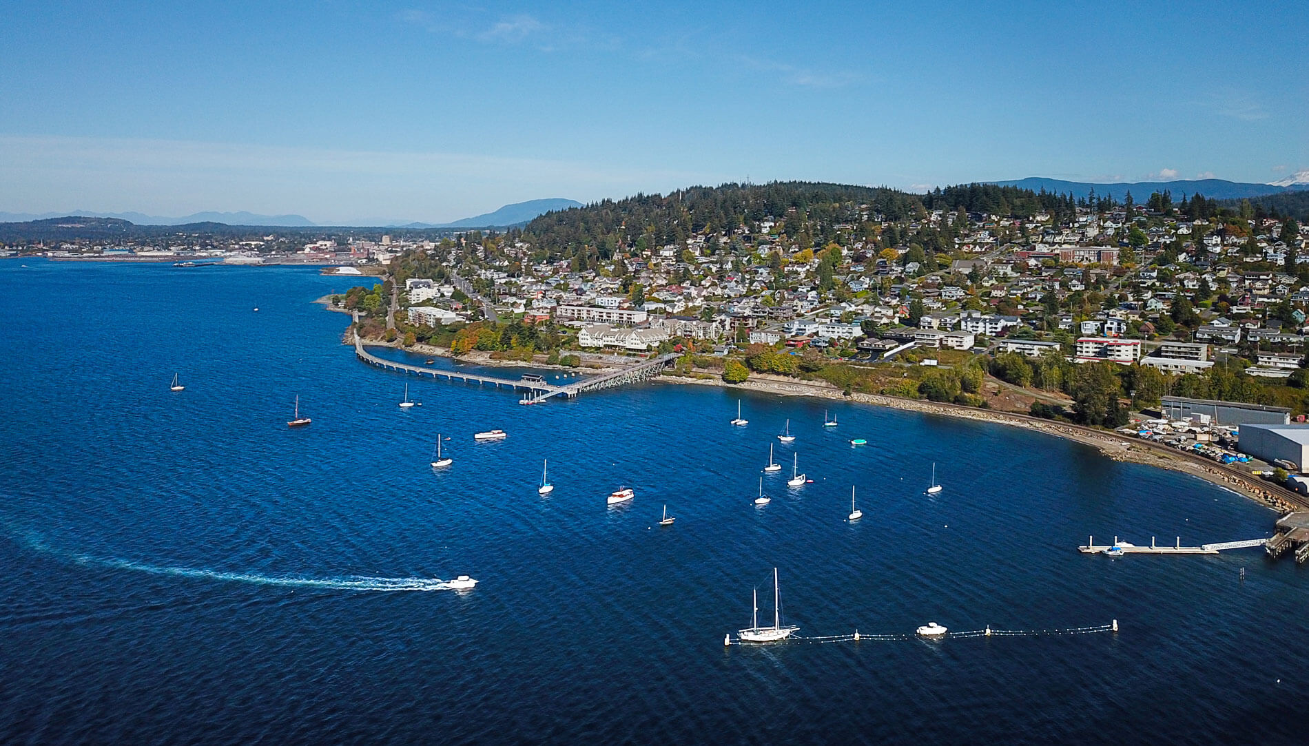 Bellingham's Taylor Dock and the Fairhaven Historic District viewed from above the blue waters of Bellingham Bay