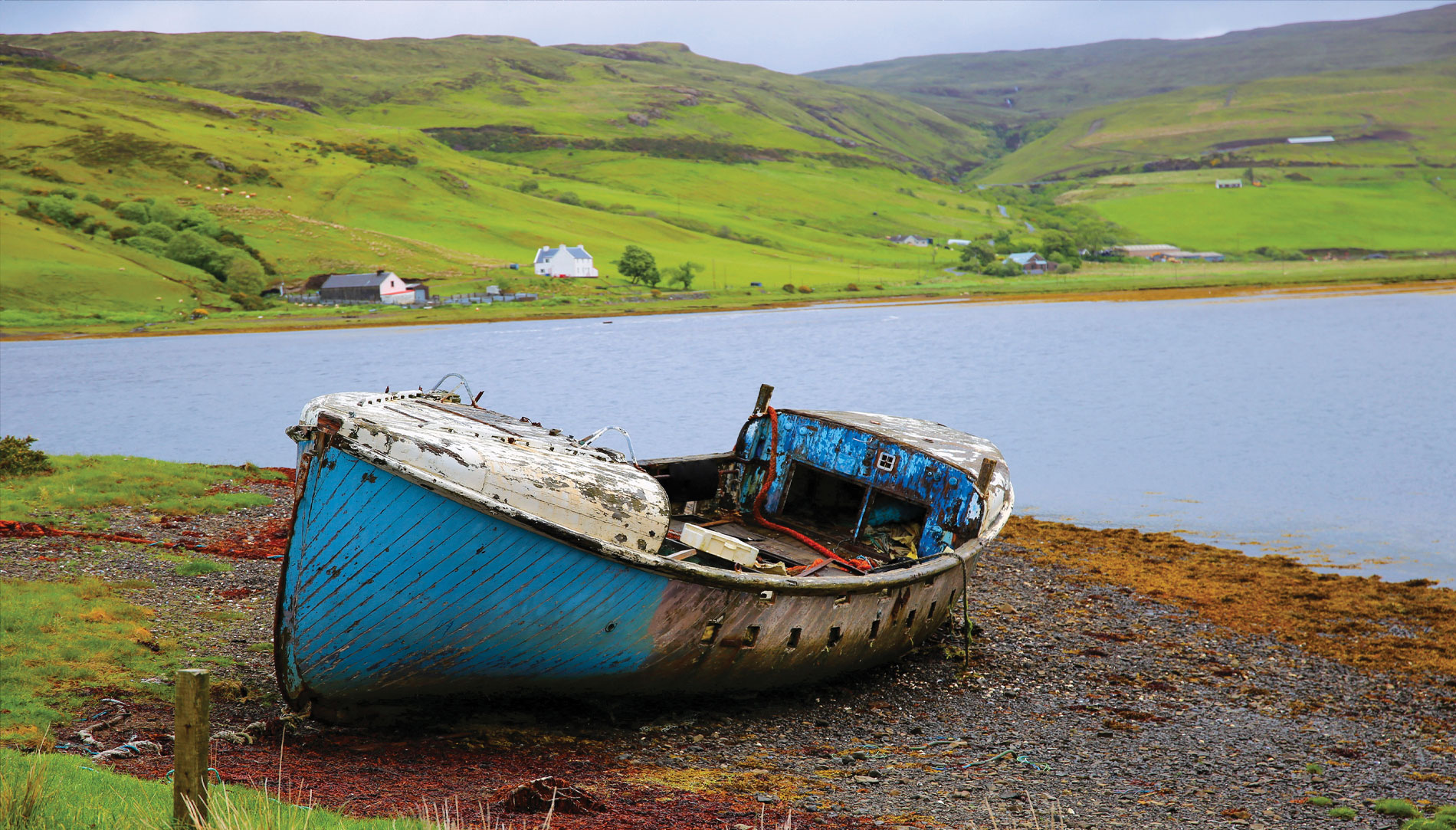 A beat-up boat on the shores of Scotland's Isle of Skye