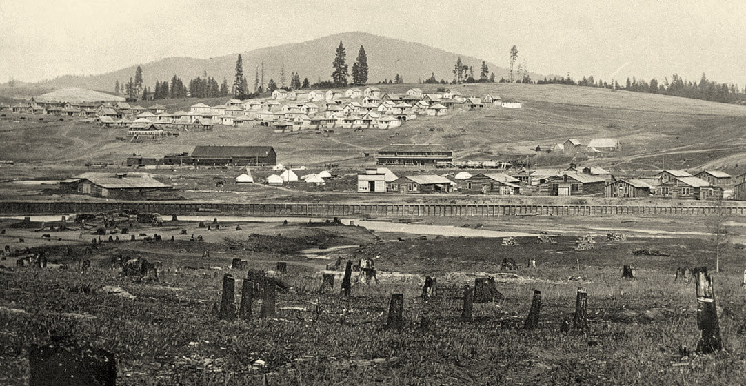 An early 20th Century image of remote Potlach, a few homes and settlements on a hill