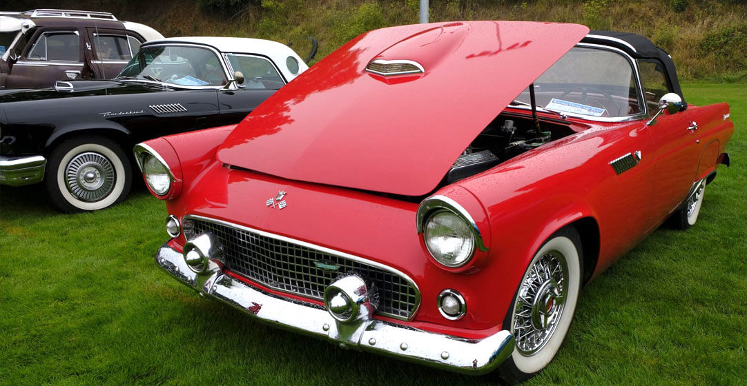 Classic red convertible with the hood popped