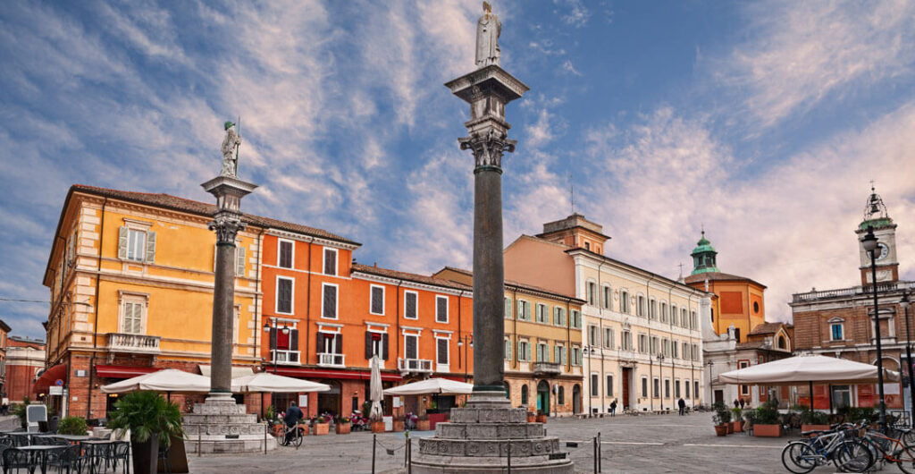 Discover the Real Italy in Emilia-Romagna. Pictured here is the Piazza del Popolo and statues of Saint Apollinare and Saint Vitale. Photo: Ermess/AdobeStock