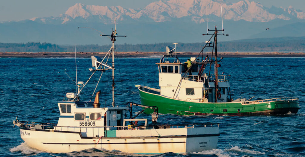 The Olympic Mountains provide a stellar backdrop to Grays Harbor and the Westport fishing fleet. Photo: Lost River Photography