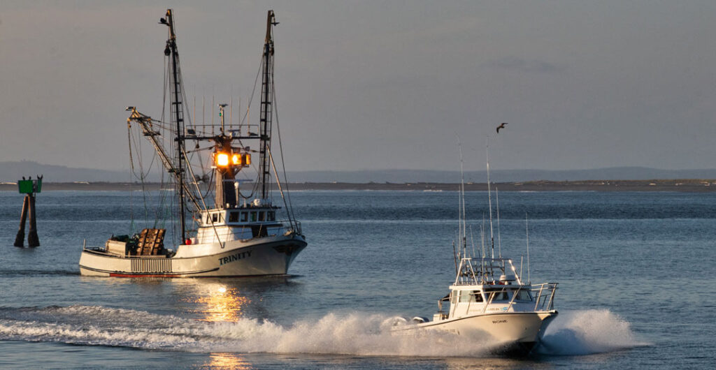 The race is on as both commercial and charter boats head home from a day's fishing. Photo: Lost River Photography