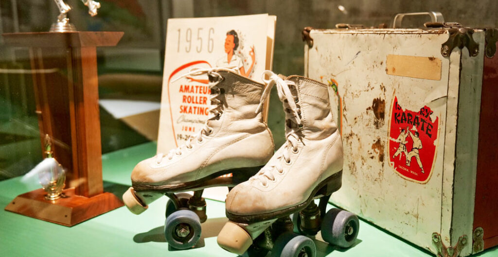 A pair of well-worn white roller skates at the Washington State History Museum. 