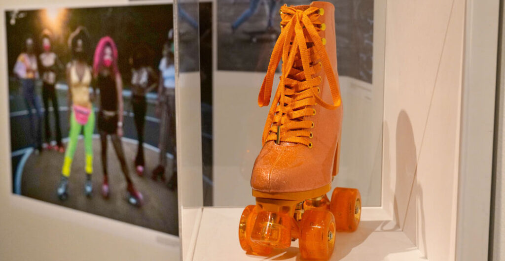 An orange skate display and pictures of roller skaters through the decades are part of the new roller skating exhibit at the Washington State History Museum in Tacoma. 