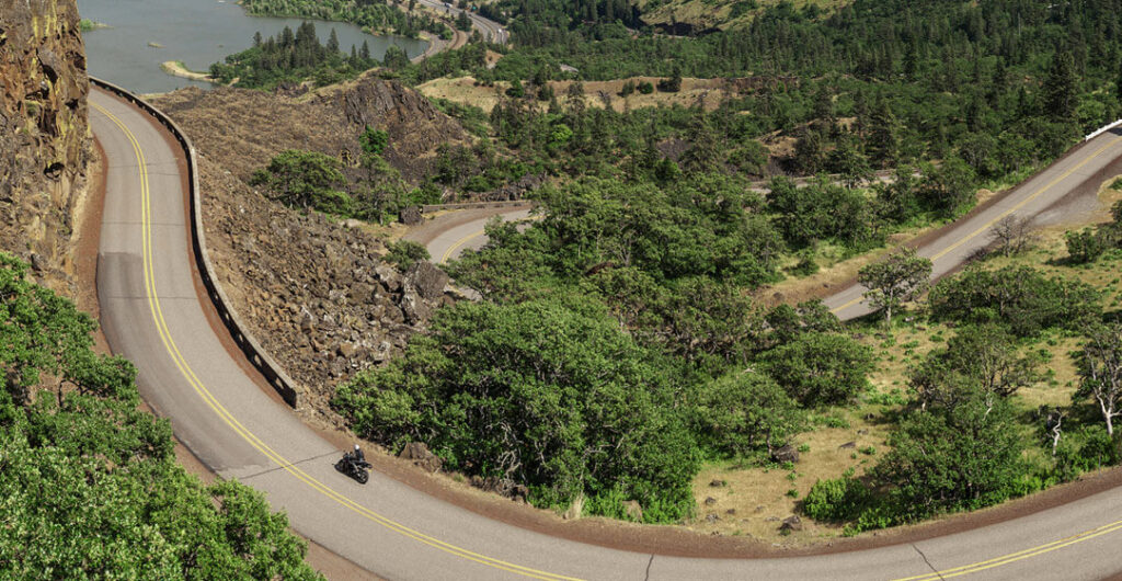 A motorcycle winds through a section of Highway 14 in the Columbia River gorge. 