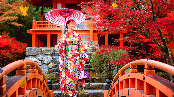 smiling japanese woman holding umbrella