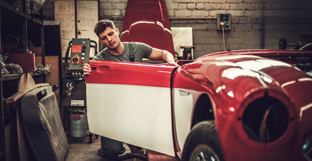classic car insurance mechanic restoration shop by nejron photo AdobeStock