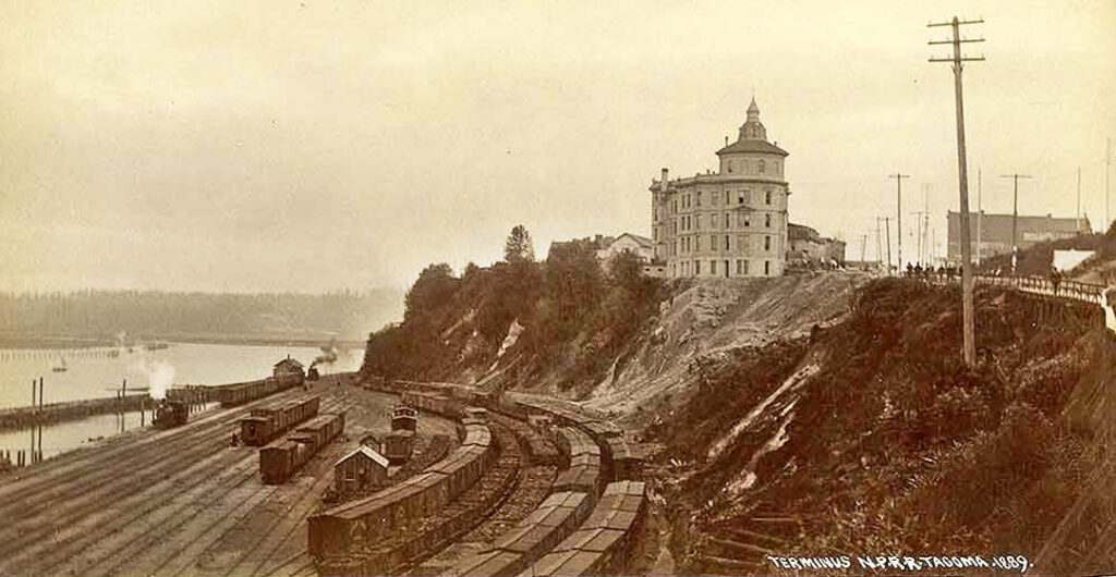 The new Washington museum exhibit "End of the Line" at the Washington State History Museum includes this 1889 image of the Northern Pacific Railroad headquarters and terminus at Commencement Bay in Tacoma.