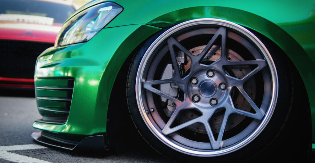Modified car insurance policies offer the same major coverage categories as regular auto policies. Ask about specialized insurance for sports cars, such as the green car pictured here.