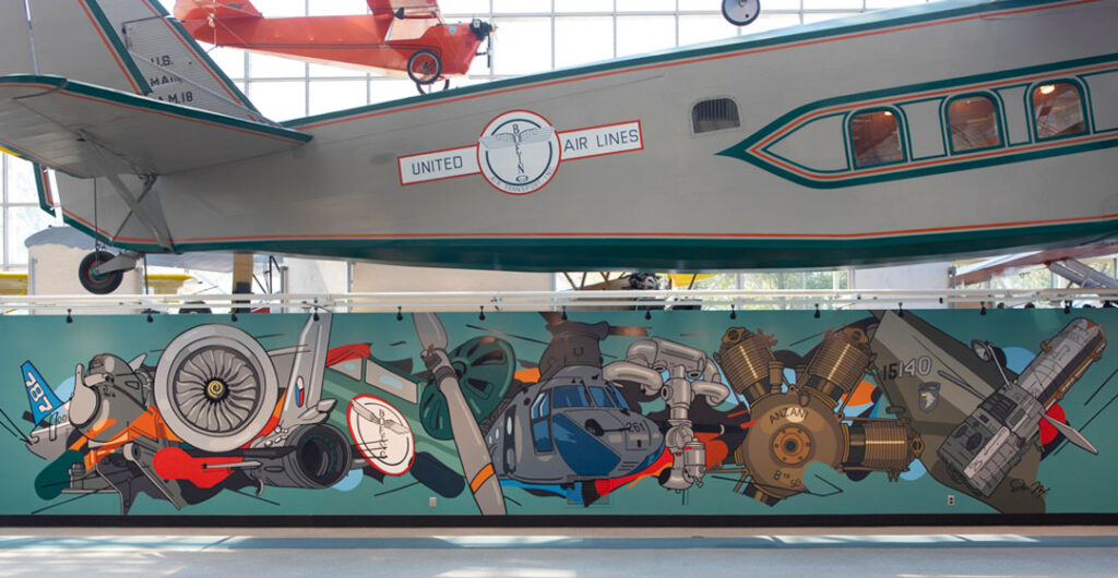 The Museum of Flight's Art + Flight exhibit shows many artists including this painting, Assemblage, 2023, a full view of the hand-painted mural by Joe Nix.