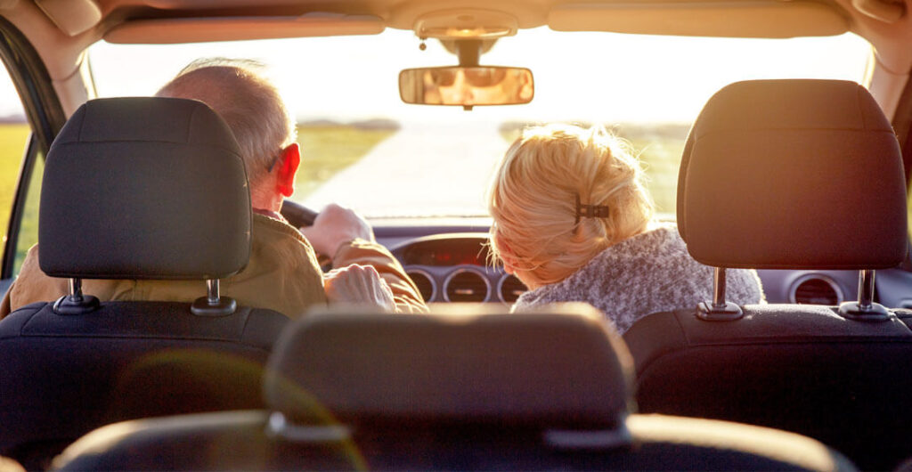 An elderly man and woman is pictured driving in a photo taken from the backseat, to illustrate that all new drivers are not necessarily youthful drivers. 
