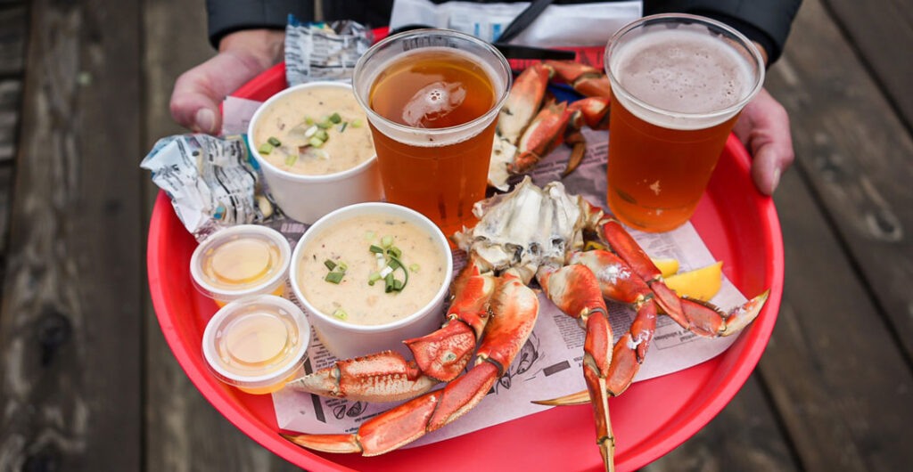 Ice cold beer pairs well with fresh crab and a side of chowder. Pictured here, a feast at Icy Straight Point.