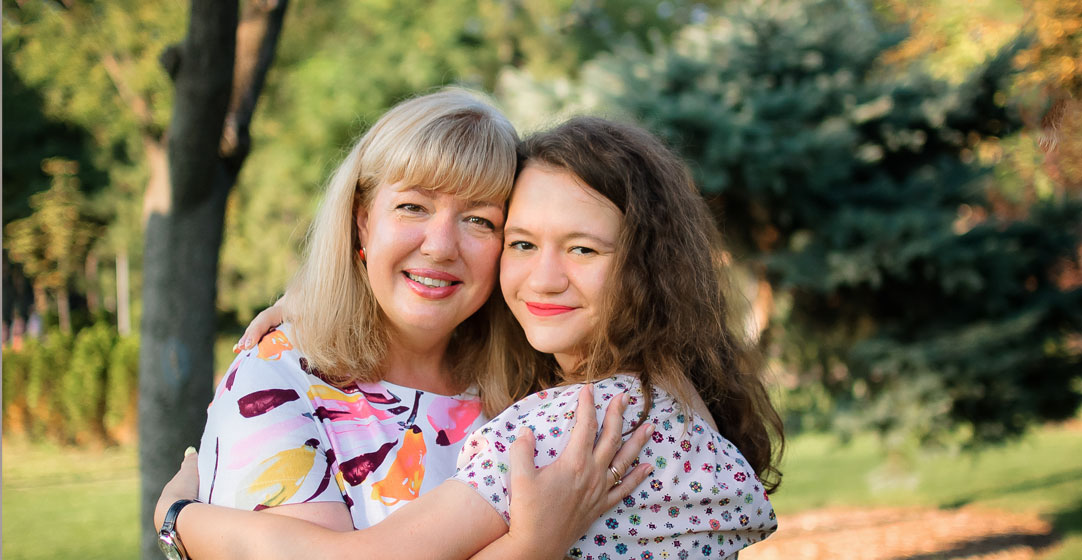 There are many reasons to get life insurance, especially taking care of your family. Pictured here, a mother and teen daughter.